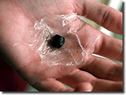 Black Tar Heroin in hand